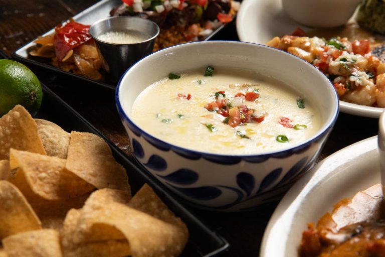 Close up of queso with chips