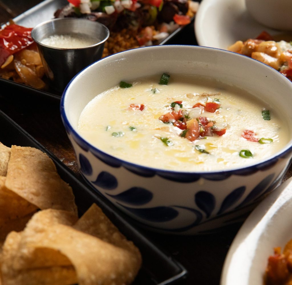 Close up of queso with chips