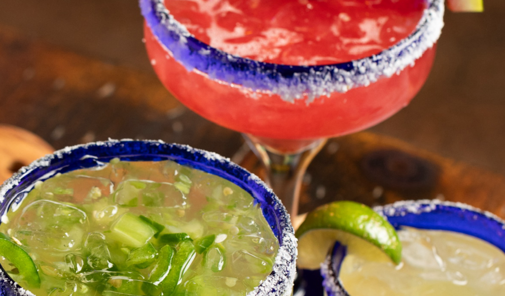 Close up shot of strawberry margarita and jalapeno margarita.